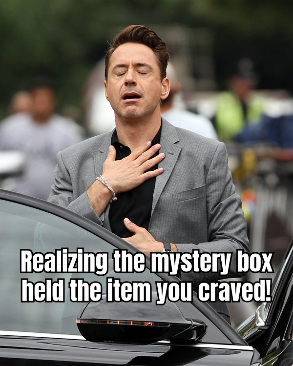 A man with an exaggeratedly excited expression opening a box, with the caption "When you finally find out what's inside the mystery box!" to add humor to the anticipation of opening a mystery box.